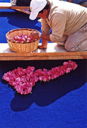 Guatemalan Places Flowers On Carpet